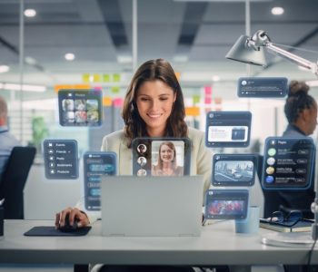 Young,Businesswoman,Using,Laptop,Computer,In,Office,With,Colleagues.,Stylish Young,Businesswoman,Using,Laptop,Computer,In,Office,With,Colleagues.,Stylish